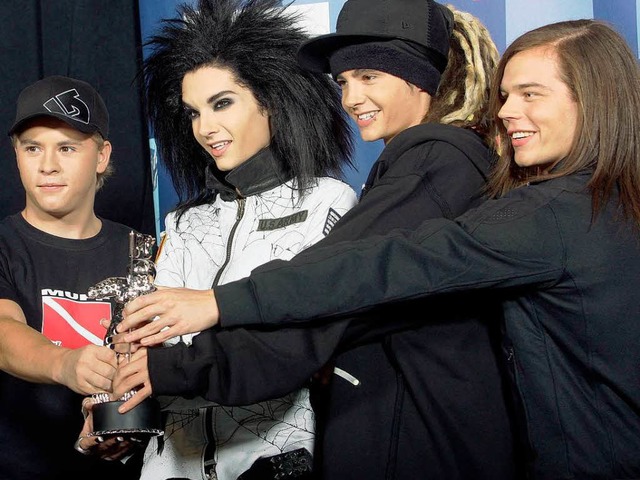 Eine Band und ihre Trophe: Tokio Hotel bei den MTV Music Video Awards.   | Foto: Getty Images/AFP