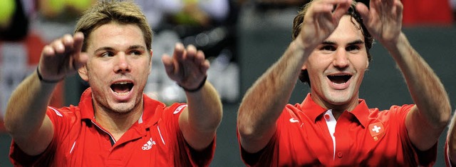 Hnde hoch!  Stanislas Wawrinka (links...Olympiasieger zu den Turnierfavoriten.  | Foto: afp