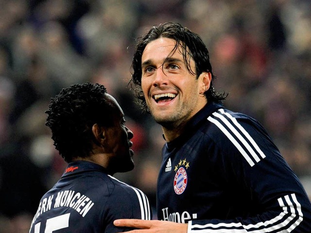 Schadenfreude? Ze Roberto und Luca Toni vom FC Bayern Mnchen.  | Foto: dpa