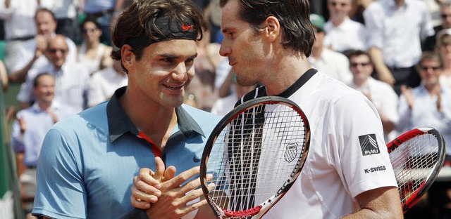 Ein erleichterter Roger Federer (links...Tommy Haas zu dessen starken Leistung.  | Foto: dpa