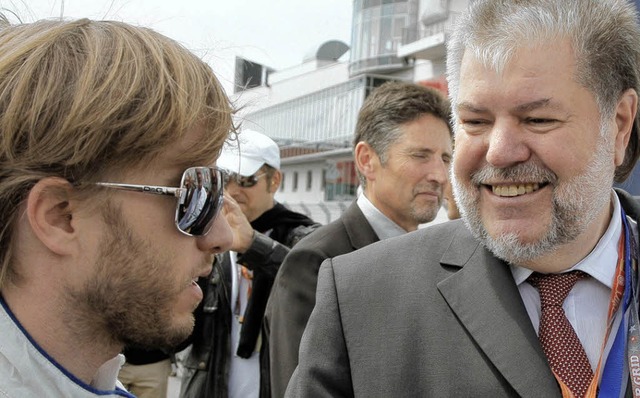 Rennfahrer trifft Politiker: Nick Heidfeld (links) und Kurt Beck  | Foto: dpa