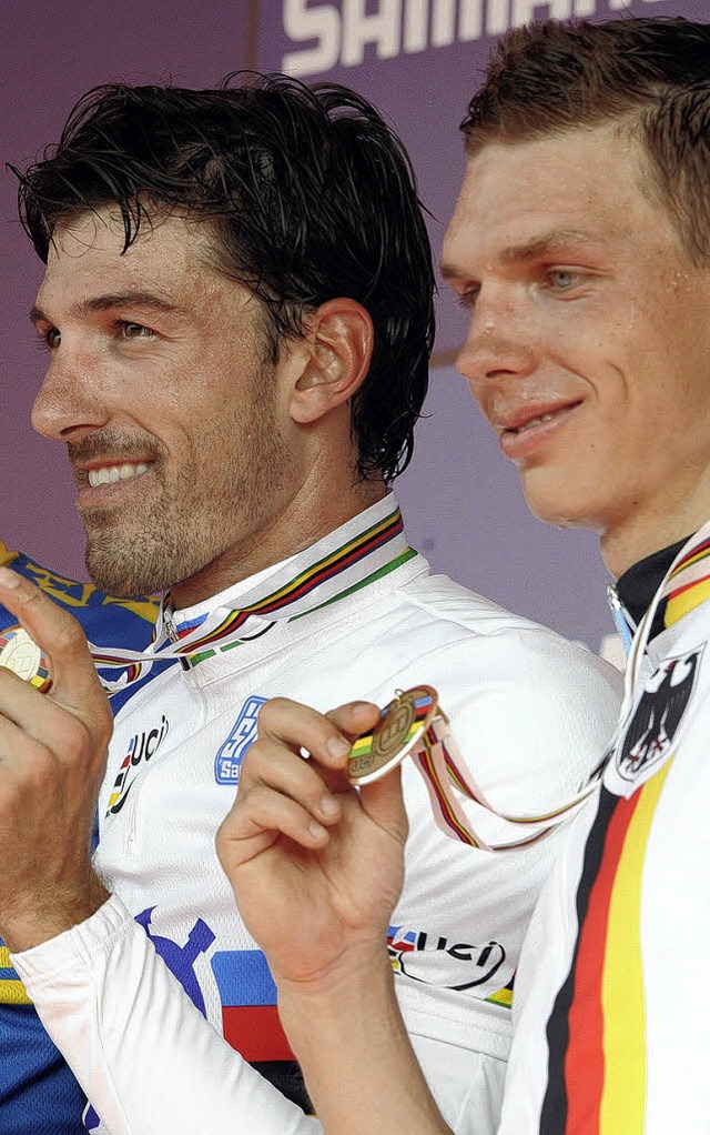Der neue Zeitfahr-Weltmeister Fabian Cancellara (links) und Tony Martin   | Foto: afp