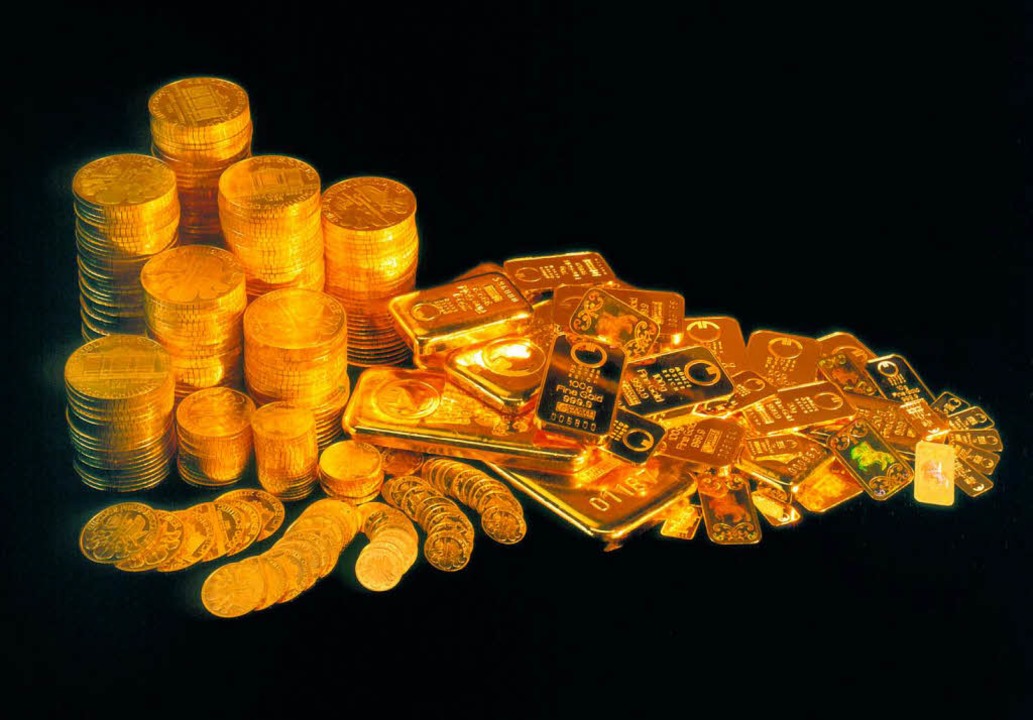 Goldmünzen und Barren.  | Foto: A0009 dpa