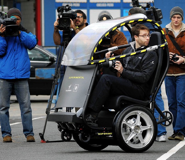 Ungewhnlicher Prototyp: Mit dem zweis...eneral Motors  durch die Innenstdte.   | Foto: dpa