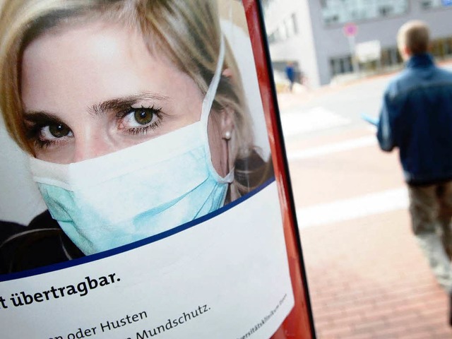 Schweinegrippe: Warnplakat der Uniklinik Essen.  | Foto: dpa