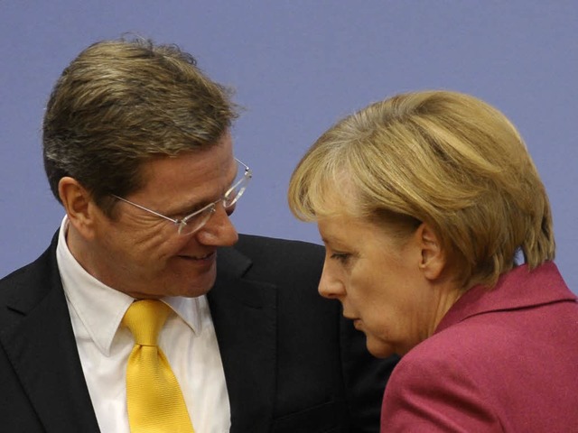 Angela Merkel (CDU) mit FDP-Koalitionspartner Guido Westerwelle.  | Foto: ddp