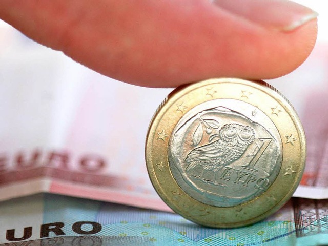 Symbol fr ein Finanzdebakel: Die griechische 1-Euro-Mnze.  | Foto: dpa