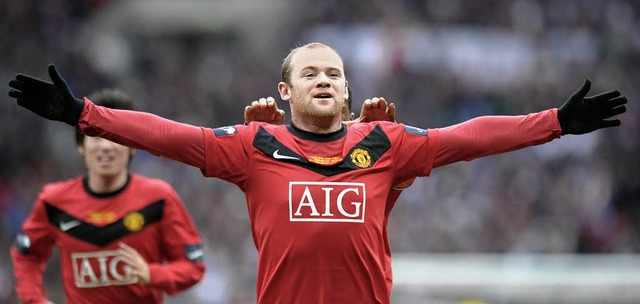Handauflegen ist bei Wayne Rooney in d...ntig. Er schiet auch so viele Tore.   | Foto: afp