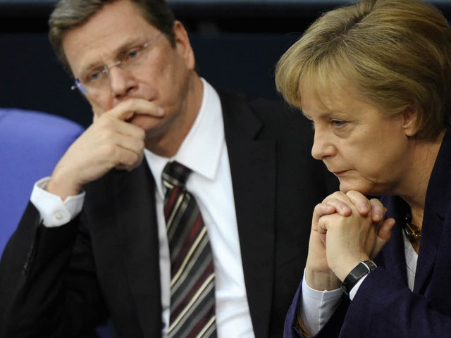 Auenminister Guido Westerwelle (FDP) und Kanzlerin Angela Merkel (CDU).  | Foto: ddp