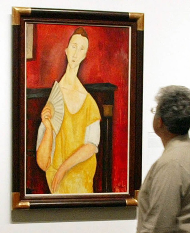 Da hing die Frau mit dem Fcher  noch:...estern gestohlene Modigliani-Gemlde.   | Foto: AFP