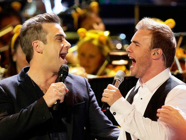 Sie haben sich wieder: Robbie Williams und Gary Barlow  | Foto: dpa