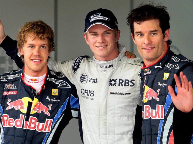 Umrahmt von zwei Titelkonkurrenten: Ni...l) und Mark Webber (r) auf die Pltze.  | Foto: dpa