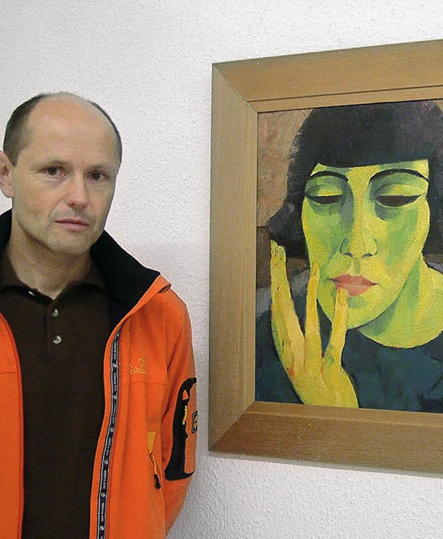 Andreas Obrecht vor einem Ibenthaler-Portrt   | Foto: Roswitha Frey