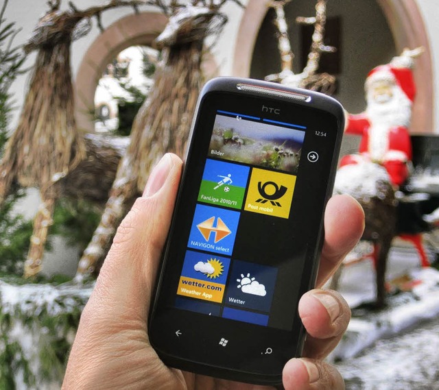 Frhliche Weihnacht: Mit Windows Phone...der iPhones und Androiden angekommen.   | Foto: ANSELM BUSSHOFF