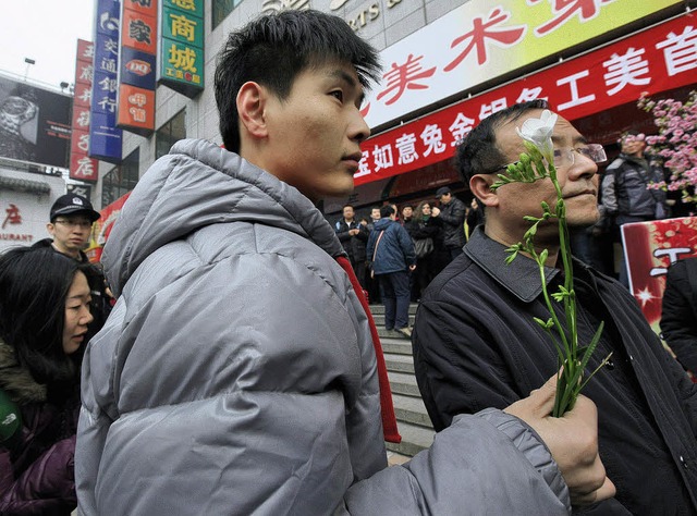 Der arabische Revolutionsfunke in China? Demonstranten in Peking   | Foto: dpa