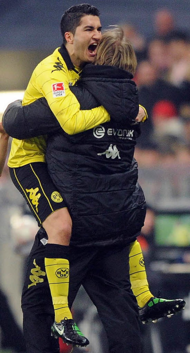 Dortmunds Torschtze zum 2:1,  Nuri Sa... Armen seines Trainers Jrgen Klopp.    | Foto: dapd