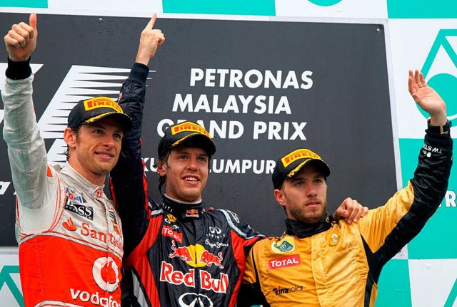 Jenson Button, Sebastian Vettel und Ni...idfeld (v. l.) haben Grund zum Feiern.  | Foto: dpa
