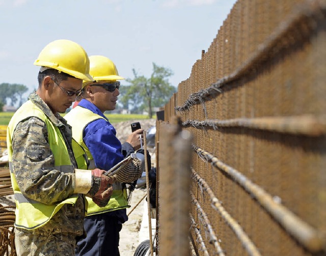 Chinesische Bauarbeiter in Zentralpolen   | Foto: AFP