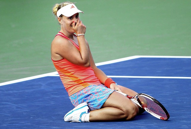 Nach dem Matchball: Angelique Kerber k...en, dass sie nun im Halbfinale steht.   | Foto: AFP