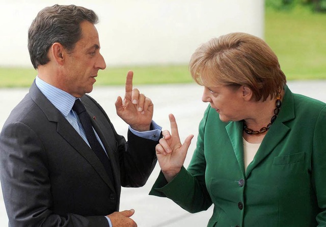 Angela Merkel und Nicolas Sarkozy (Archivbild vom 20. Juli 2011).  | Foto: dpa