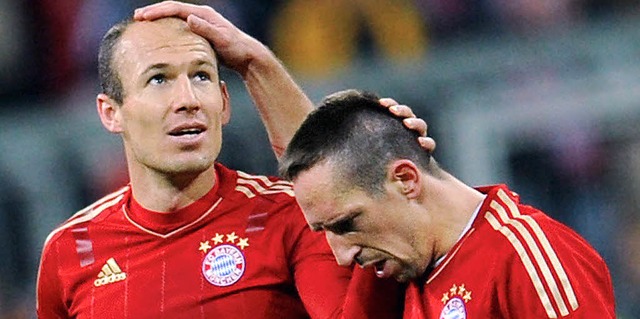 Streicheleinheiten: Arjen Robben (links) und Franck Ribry  | Foto: dpa