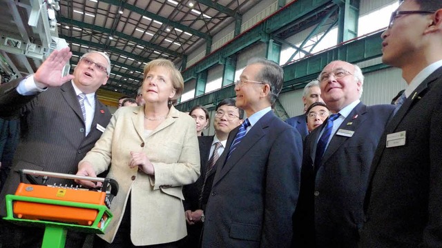 Die deutsche Bundeskanzlerin  Angela M...en das Herrenknecht-Werk in Guangzhou.  | Foto: Herrenknecht