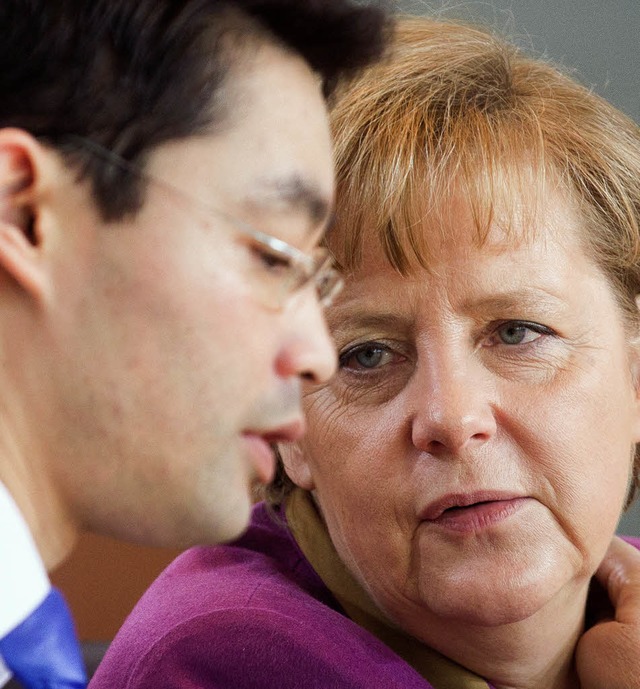 Rsler und Merkel   | Foto: DPA