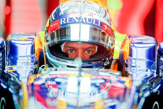Sebastian Vettel konzentriert sich auf...itische Fragen zu Bahrain rigoros ab.   | Foto: DPA/DAPD
