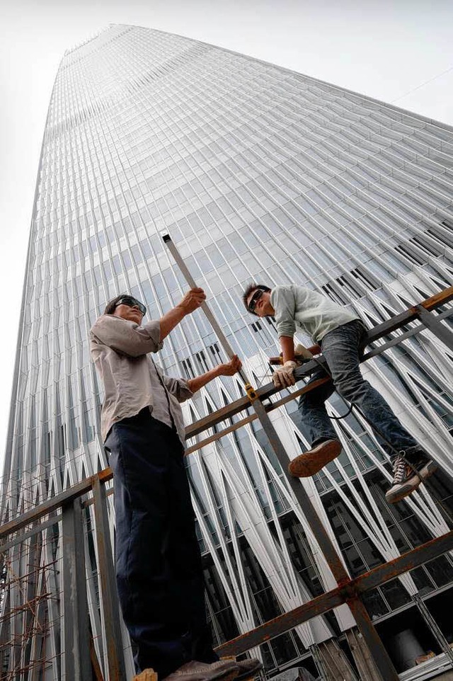 Arbeiter in Peking &#8211; in China un...en Wachstums  lngst nicht erreicht.    | Foto: AFP