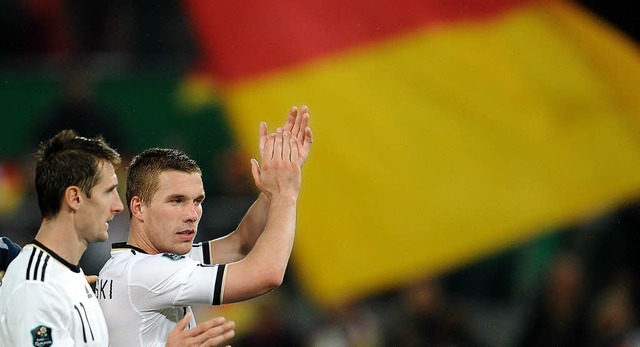 Deutsche Nationalspieler mit polnische...iroslav Klose (l.) und Lukas Podolski   | Foto: dpa
