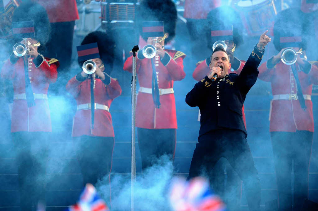 Robbie Williams sang nicht nur – er war quais der Cheforganisator des Konzerts fr die Queen.