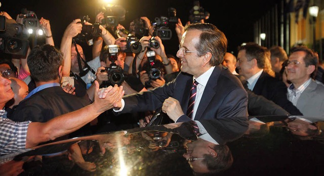 Geqult lchelnd und erfolgreich nicht...s-Mandate:  Wahlsieger Antonis Samaras  | Foto: DPA