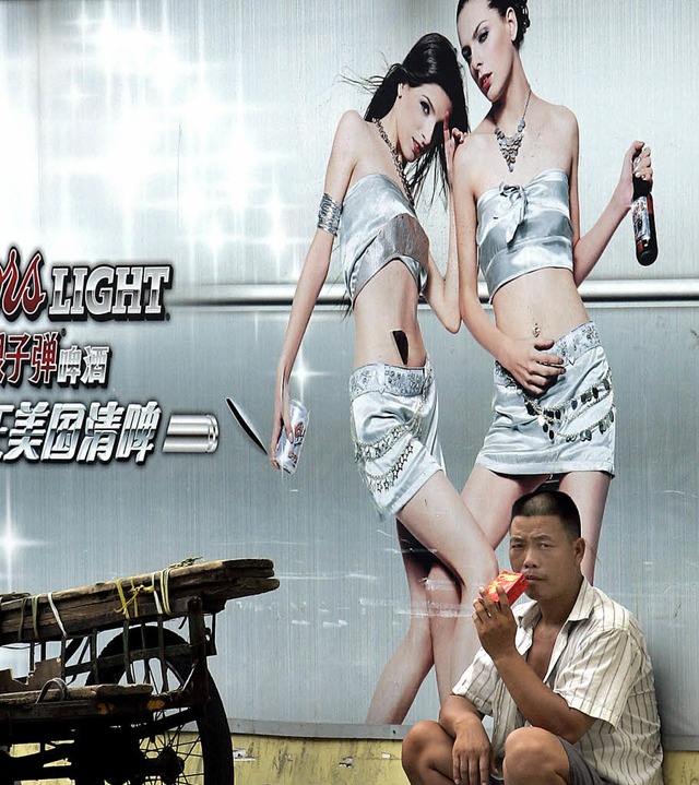 Auch er strebt den sozialen Aufstieg i...lichen Wirtschaftsmetropole Guangzhou.  | Foto: AFP