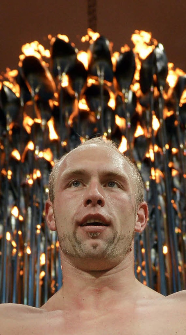 Robert Harting feierte vor der olympis... &#8211; mit textilfreiem Oberkrper.   | Foto: dapd