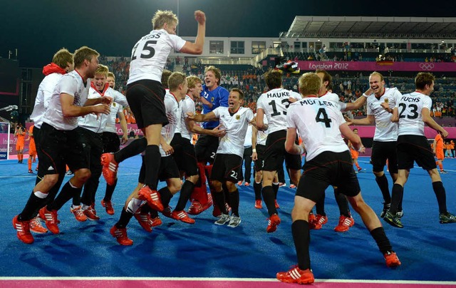 Die deutschen Hockey-Mnner feierten a... ihren Gold-Sieg ber die Niederlande.  | Foto: dapd