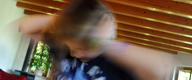 Ein zehnjhriger Junge hlt und schtt...tienten mehr im Blick haben - und zwar  | Foto: Verwendung weltweit, usage worldwide