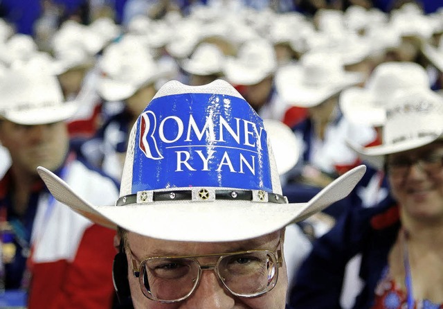 Ein Delegierter aus Texas wirbt beim P...aner   fr Mitt Romney und Paul Ryan.   | Foto: DAPD