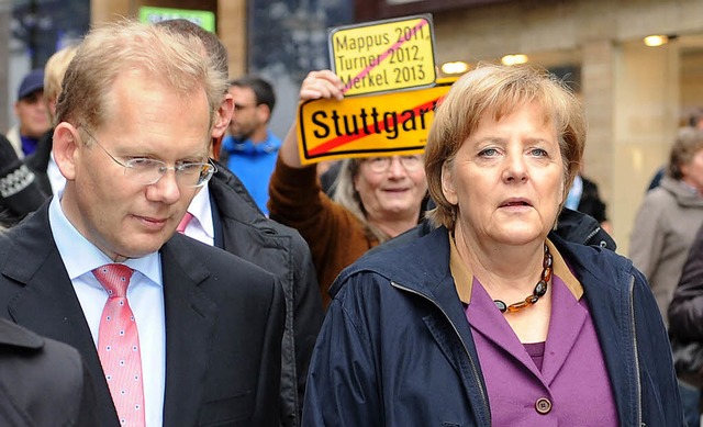 OB-Kandidat Sebastian Turner und Kanzlerin Angela Merkel   | Foto: dpa