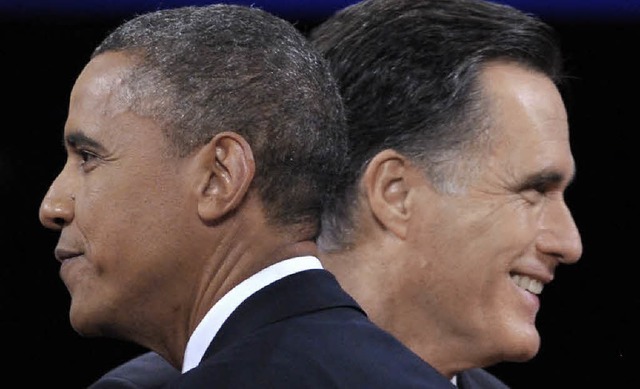 Prsident Barack Obama verabschiedet sich von Mitt Romney nach der TV-Debatte.    | Foto: AFP