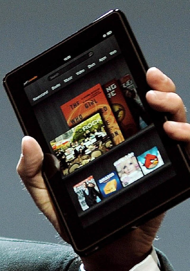 Amazons Kindle Fire HD wildert erfolgreich im Apfelhain.   | Foto: Fotos (3)<ZAM-BlindTextAus></ZAM-BlindTextAus>:dpa