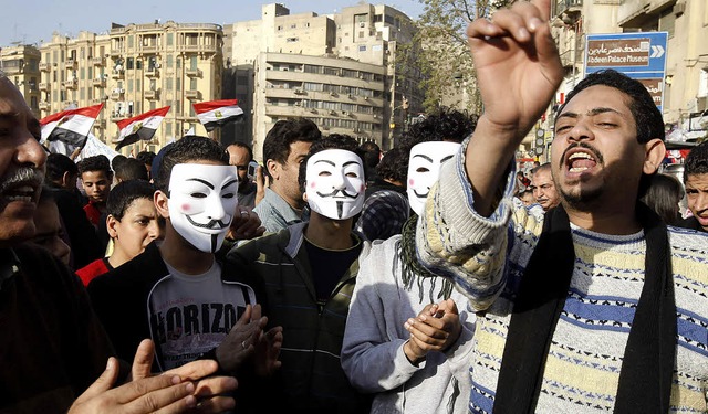 Mit Masken der Anonymous-Bewegung demo...unge gypter am 25. Januar in Kairo.    | Foto: AFP