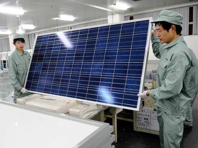 Ein Bild aus besseren Tagen: Produktion bei Suntech vor einem Jahr   | Foto: AFP