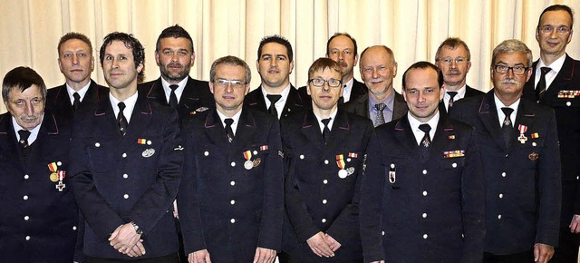 Geehrte und Ehrende bei der Feuerwehr ...r Hellmann, Kommandant Reiner Graupe.   | Foto: Reiner Beschorner