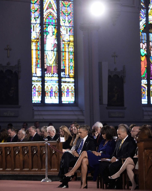 Prsident Barack Obama und seine Frau ...Trauerfeier fr die Opfer  in Boston.   | Foto: AFP