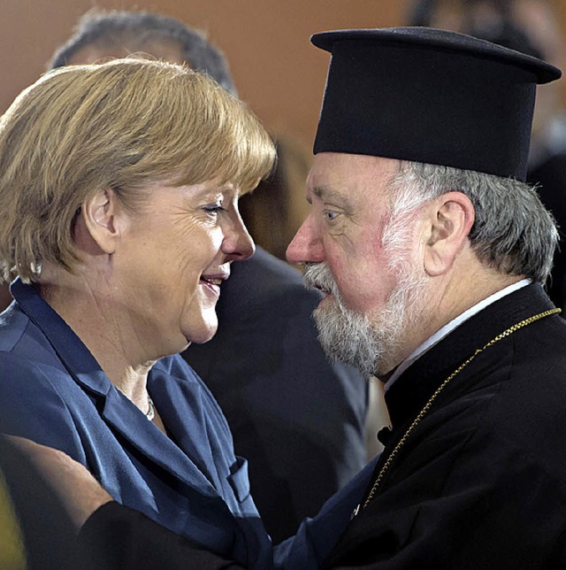 Merkel  und Erzpriester Malamoussis beim  Gipfel in Berlin   | Foto: DPA