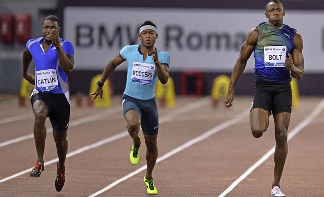 Gatlin  (links) war schneller als Bolt (re.).   | Foto: AFP