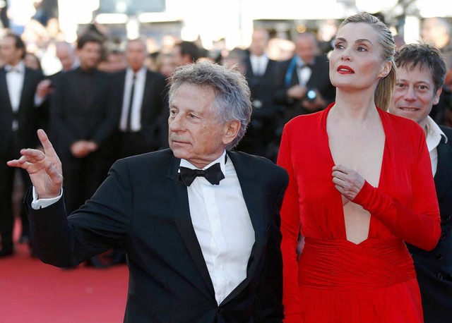 Im Mai 2013 beim Filmfestival in Canne...ski und seine Frau Emmanuelle Seigner.  | Foto: dpa