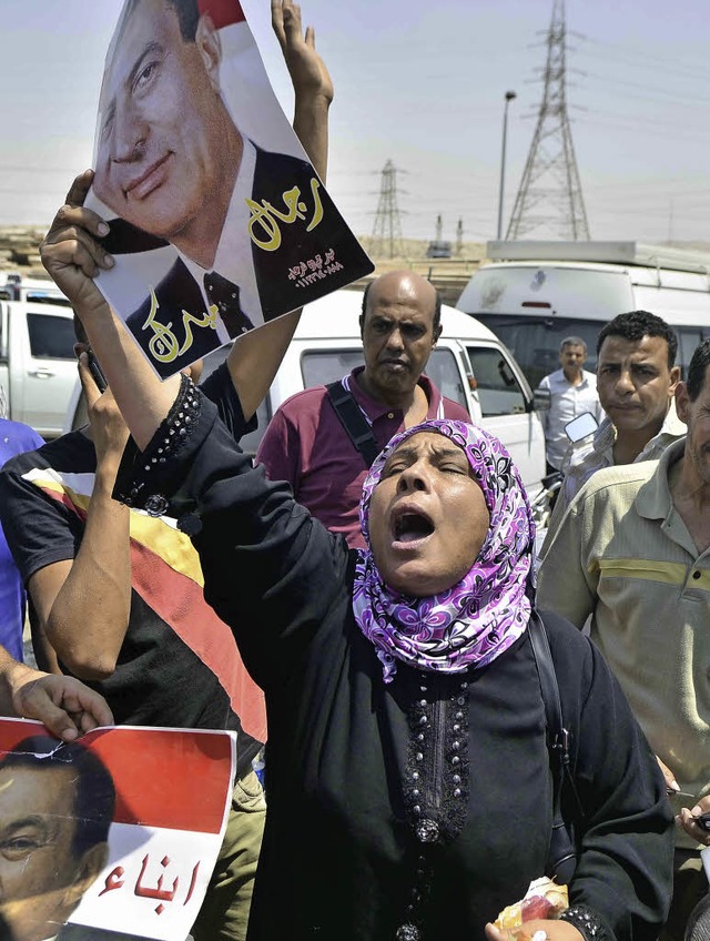 Eine Mubarak-Untersttzerin freut sich ber dessen Freilassung.   | Foto: AFP