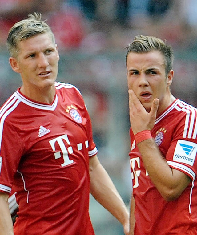 Mssen passen: Bastian Schweinsteiger (links) und Mario Gtze   | Foto: dpa