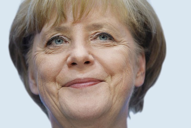 Einen Triumph feiert sie nicht: Angela Merkel am Montag nach der Wahl   | Foto: afp